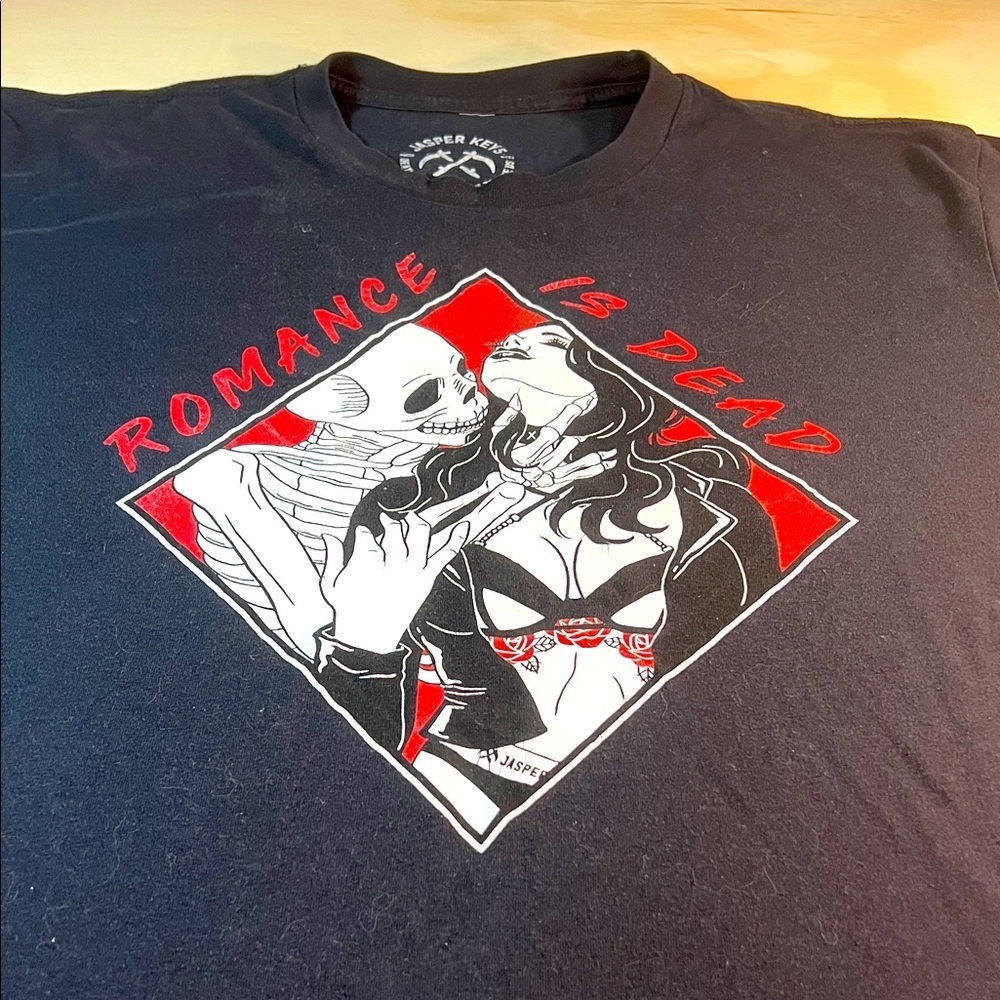 Black Graphic T-Shirt “Romance is Dead”
Sz L
